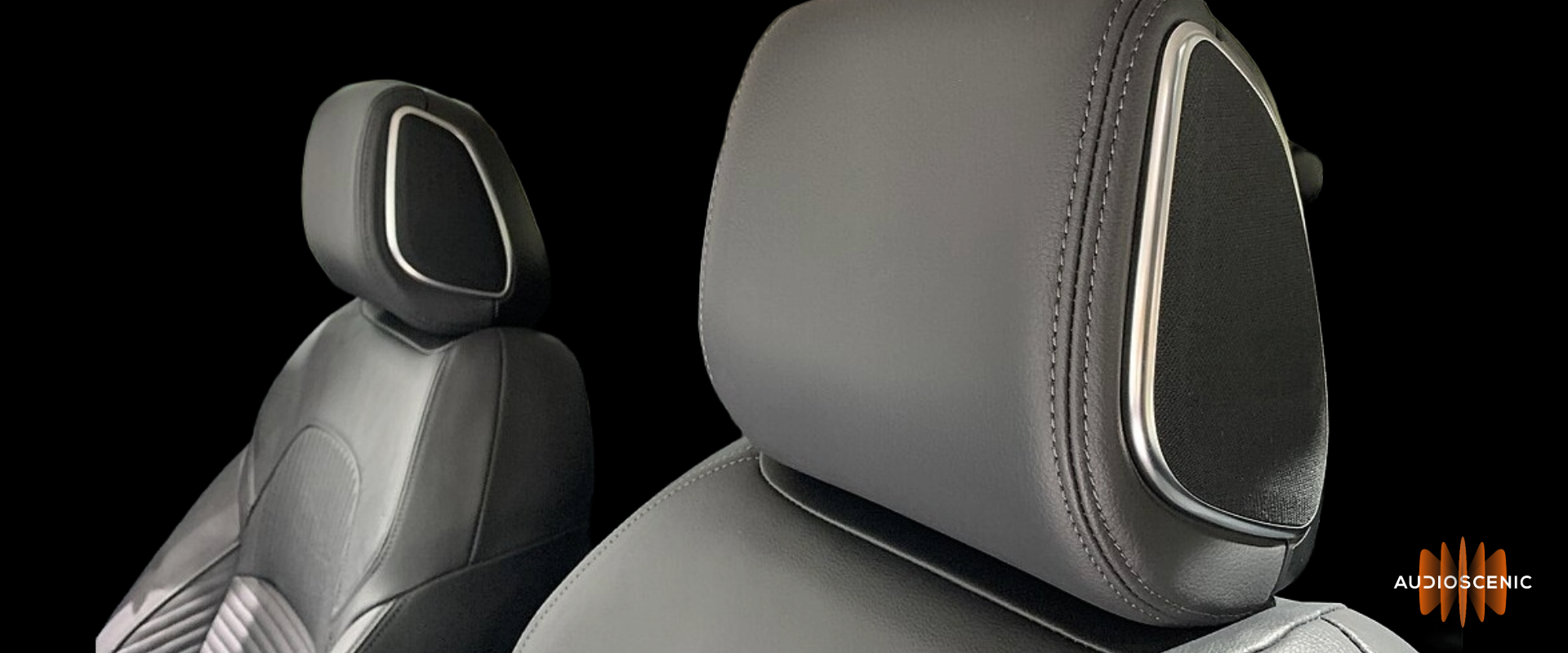 Image showing speakers embedded into headrest of a car Image showing speakers embedded into headrest of a car